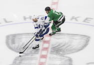 Dallas Stars center Mattias Janmark (13) chases Tampa Bay Lightning defenseman Kevin Shattenkirk (22) during the first period of Game 4 of the NHL hockey Stanley Cup Final, Friday, Sept. 25, 2020, in Edmonton, Alberta. (Jason Franson/The Canadian Press via AP)