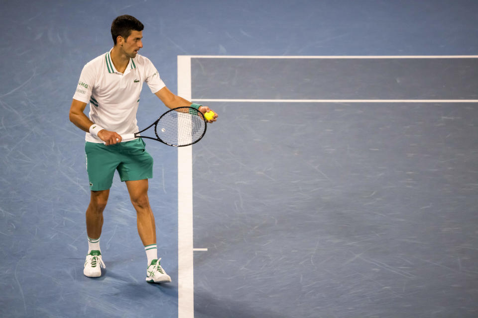 Novak Djokovic (pictured) prepares to serve the ball during an Australian Open match.