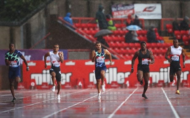 Toronto's Aaron Brown, left, won silver in the Diamond League 200-metre final in Gateshead, England, on Sunday, while Markham, Ont., native Andre De Grasse earned bronze. (Ian MacNicol/Getty Images - image credit)