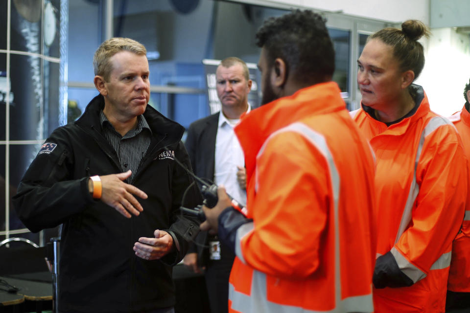 New Zealand Prime Minister Chris Hipkins, left, visits the Emergency Civil Defence Centre in Auckland, New Zealand, Tuesday, Feb. 14, 2023. The New Zealand government declared a state of emergency across the country's North Island, which has been battered by Cyclone Gabrielle. (Dean Purcell/New Zealand Herald via AP)