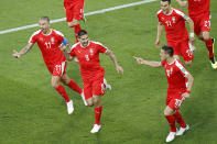 <p>Serbia’s Aleksandar Mitrovic, second left, celebrates with teammates after scoring the opening goal during the group E match between Switzerland and Serbia at the 2018 soccer World Cup in the Kaliningrad Stadium in Kaliningrad, Russia, Friday, June 22, 2018. (AP Photo/Antonio Calanni) </p>