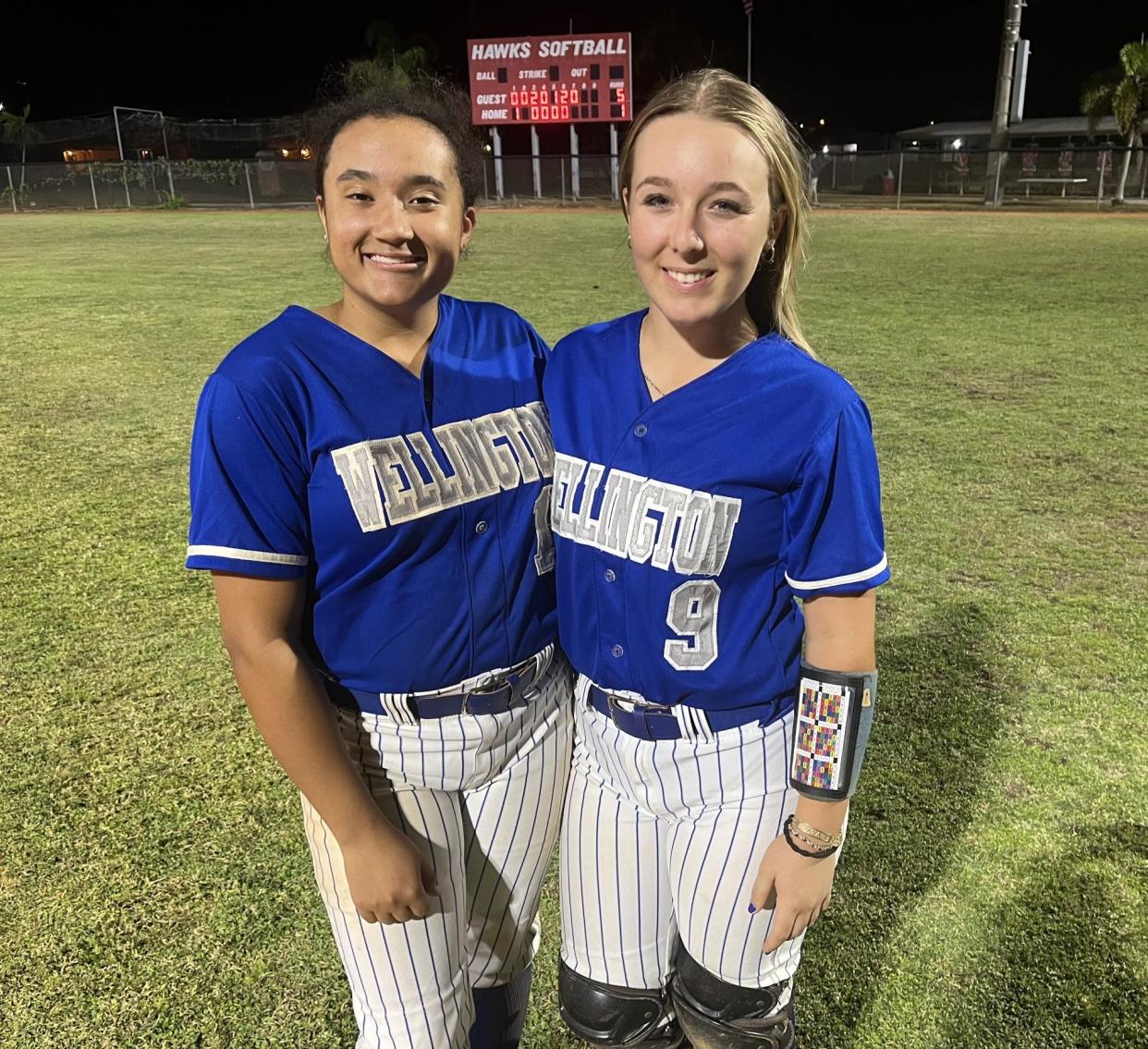 Tori Payne (left) pitched a four-hitter with 11 strikeouts and catcher Ava Matrascia had two hits and three RBIs to lead Wellington to a 5-1 win Tuesday night.