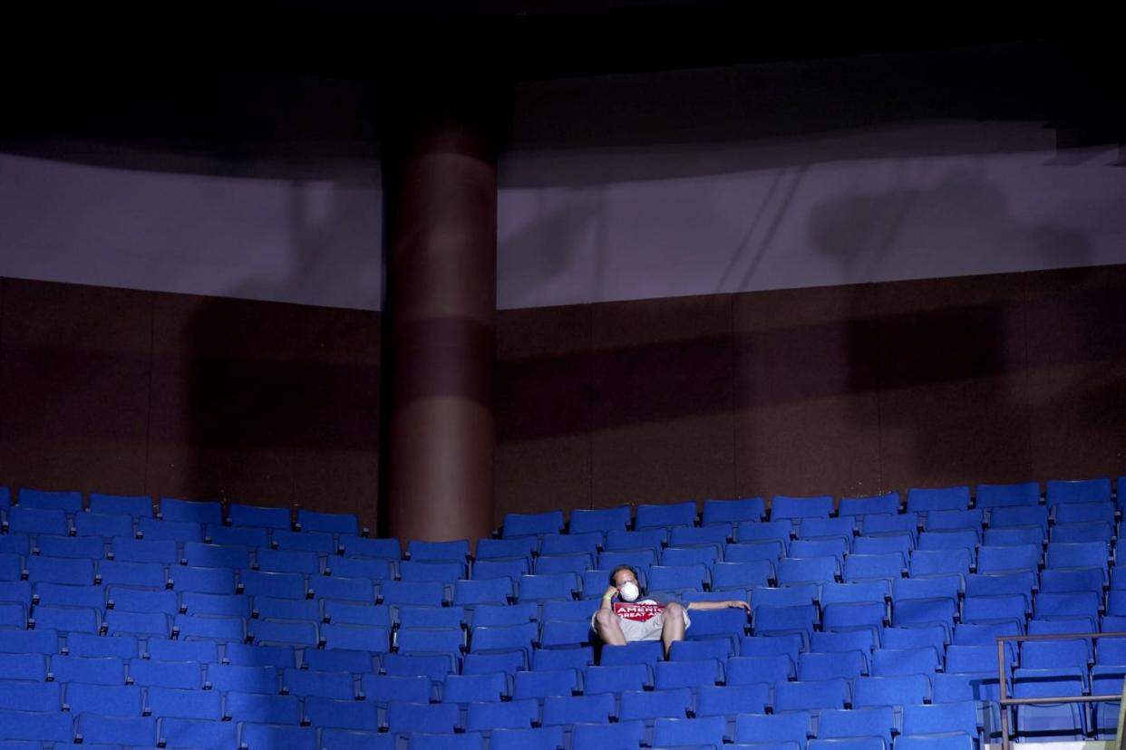 Image: A supporter sits in the stands at a campaign rally for President Donald Trump in Tulsa, Okla., on June 20, 2020. (Evan Vucci / AP)