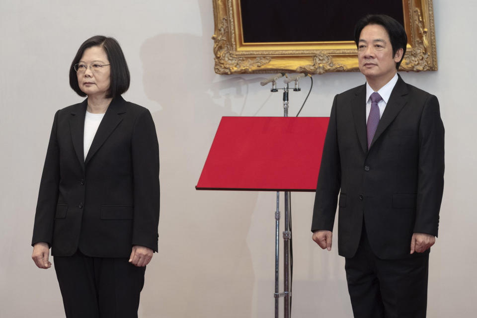 In this photo released by the Taiwan Presidential Office, Taiwanese President Tsai Ing-wen, left stands with Vice President Lai Ching-te during an inauguration ceremony at the Presidential office in Taipei, Taiwan on Wednesday, May 20, 2020. Tsai has been inaugurated for a second term amid increasing pressure from China on the self-governing island democracy it claims as its own territory. (Taiwan Presidential Office via AP)