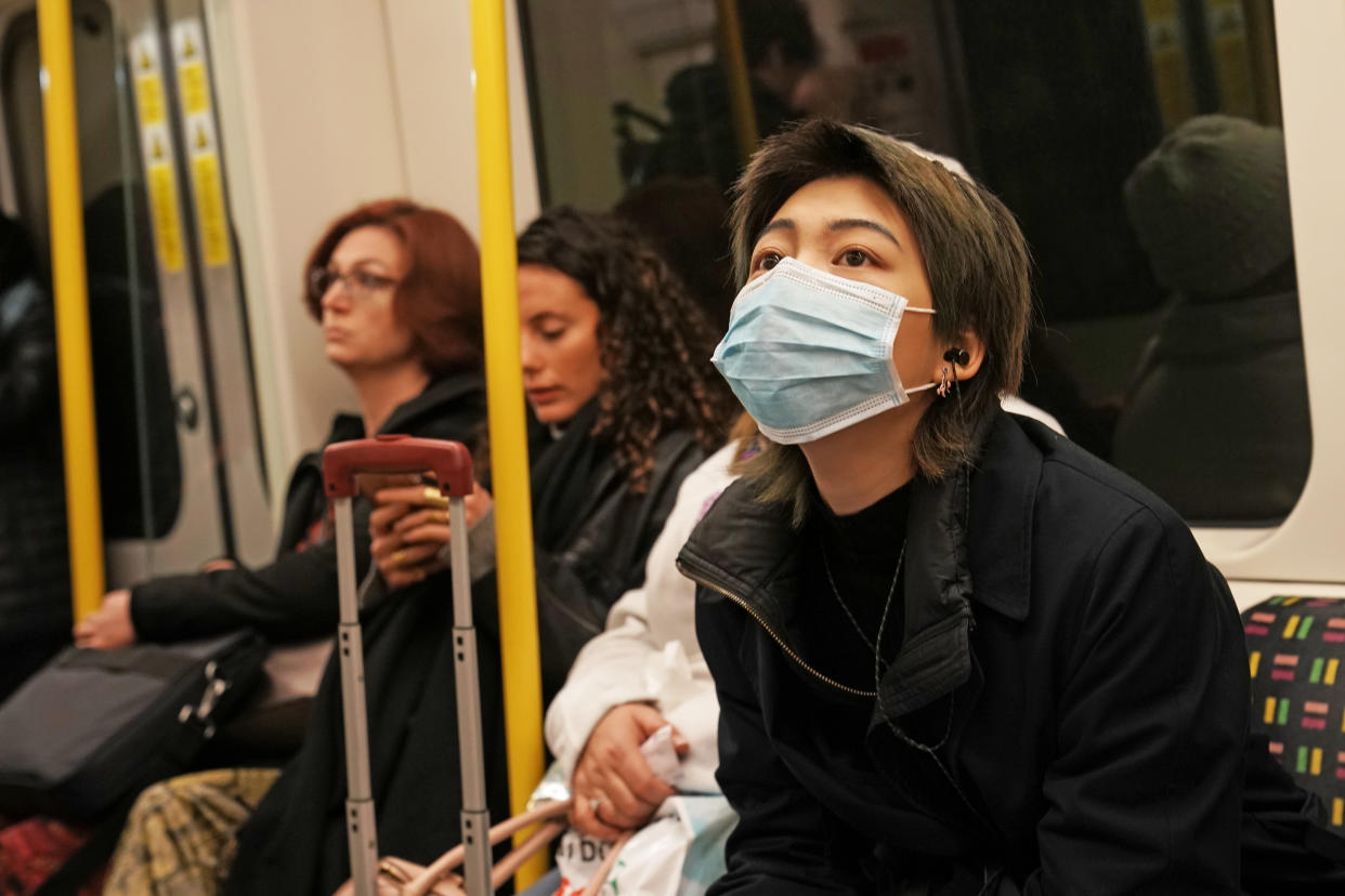 A woman wearing a face mask on the London Underground. (Photo by Owen Humphreys/PA Images via Getty Images)