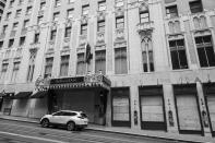 The Sir Francis Drake Hotel, known for its Beefeater doormen, is boarded up and closed at Union Square in San Francisco on April 17, 2020. Normally, the months leading into summer bring bustling crowds to the city's famous landmarks, but this year, because of the coronavirus threat they sit empty and quiet. Some parts are like eerie ghost towns or stark scenes from a science fiction movie. (AP Photo/Eric Risberg)