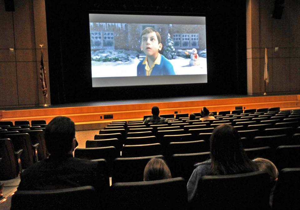 Families watch "The Polar Express" during the Scituate North Pole Express Movie Experience presented by the Community for Resources for Special Education Foundation at the Scituate Center for Performing Arts on Saturday, Dec. 4, 2021.