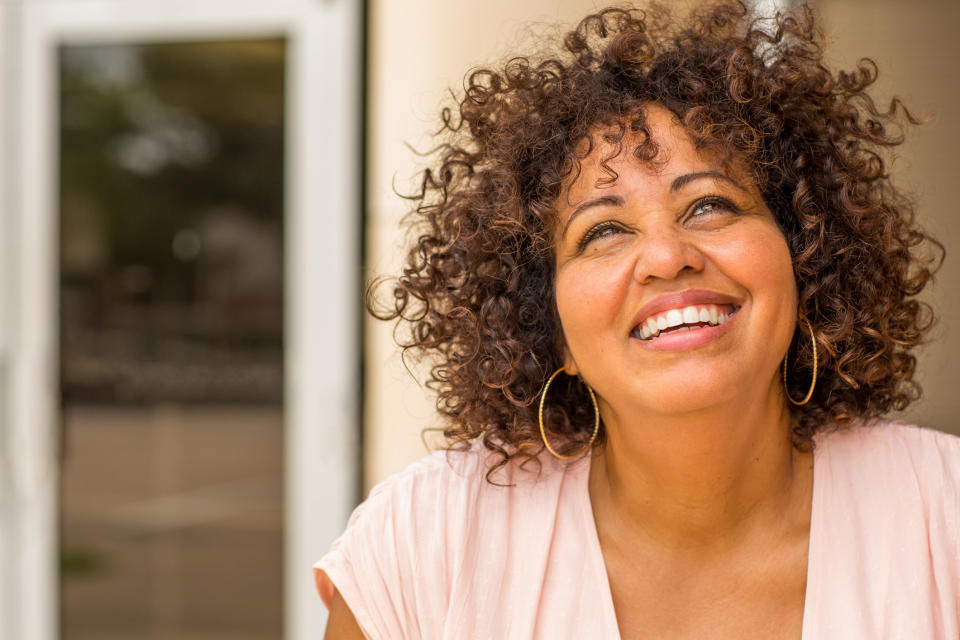 A woman looking up and smiling