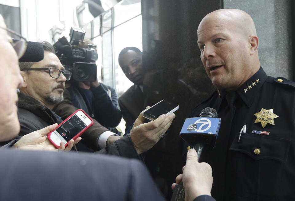 San Francisco Police Chief Greg Suhr, right, speaks to reporters after a news conference in San Francisco, Monday, Jan. 6, 2014. The FBI says a Chinese national has been arrested in the investigation of a fire set intentionally at the Chinese Consulate in San Francisco. Special FBI Agent-in-Charge David J. Johnson said Monday that 39-year-old Yan Feng of Daly City was arrested Friday after he called police in the San Francisco suburb. (AP Photo/Jeff Chiu)