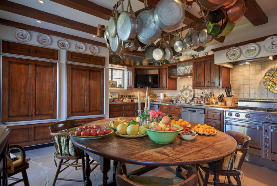 <p>The star, now 71, has preserved the mansion's French countryside aesthetic, incorporating wooden beams in bedrooms, <a rel="nofollow noopener" href="http://www.countryliving.com/home-design/decorating-ideas/a42701/clawfoot-tubs/" target="_blank" data-ylk="slk:clawfoot tubs;elm:context_link;itc:0;sec:content-canvas" class="link ">clawfoot tubs</a> in bathrooms, and a quaint kitchen that looks like it was plucked from the prettiest old farmhouse. Keep scrolling for more views of this gorgeous estate!</p>