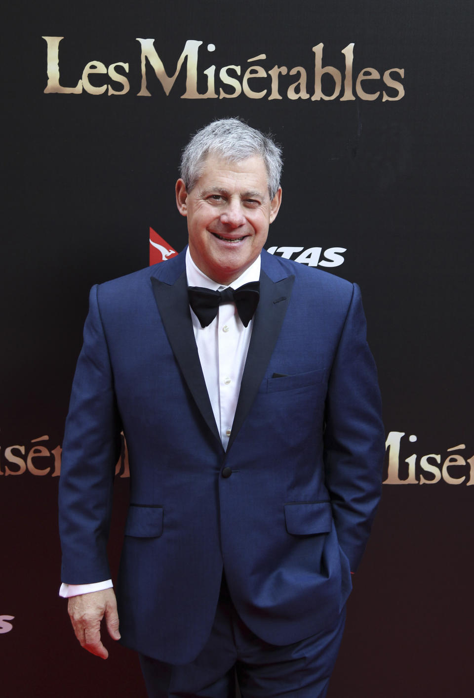 FILE - This Dec. 21, 2012 file photo shows Cameron Mackintosh, producer of the stage production of "Les Miserables" in Sydney, Australia for the premiere of the film version. Mackintosh is in New York working on a new version of "Les Miserables" that opens on Broadway this month. Mackintosh, the producer behind such mega-hits as "Cats," "The Phantom of the Opera" and "Miss Saigon, " keeps finding himself in the strange position of returning to former triumphs, stripping them down and then building them up again. "Les Miserables" opens on March 23. (AP Photo/Rob Griffith, File)