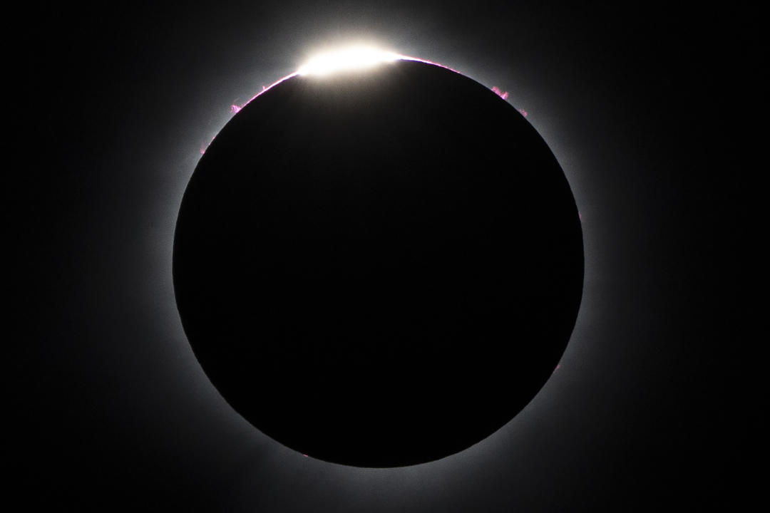 The moon nearly covers the sun during a total solar eclipse, as seen from Bishop's University in Sherbrooke, Quebec, Monday, April 8, 2024. (AP Photo/Mark Schiefelbein)