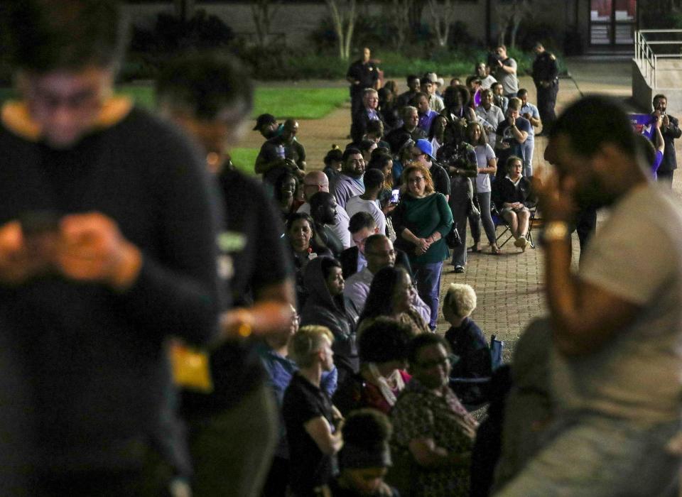 People wait in line to vote Tuesday, March 3, 2020, at Texas Southern University in Houston. As Joe Biden and Bernie Sanders racked up victories around the other 13 states holding primaries then, Texas remained a tight race hours after polls closed.