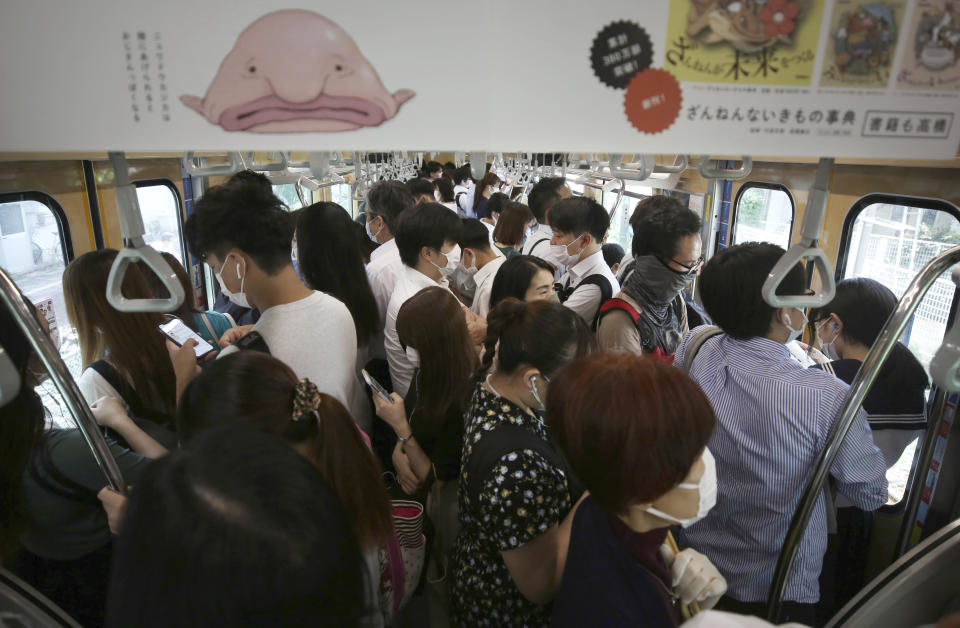 An inside of train is packed with passengers on a JR Line during a rush hour in Ota Ward, Tokyo on June 15, 2020, after Tokyo Alert was lifted in last month. Source: Getty