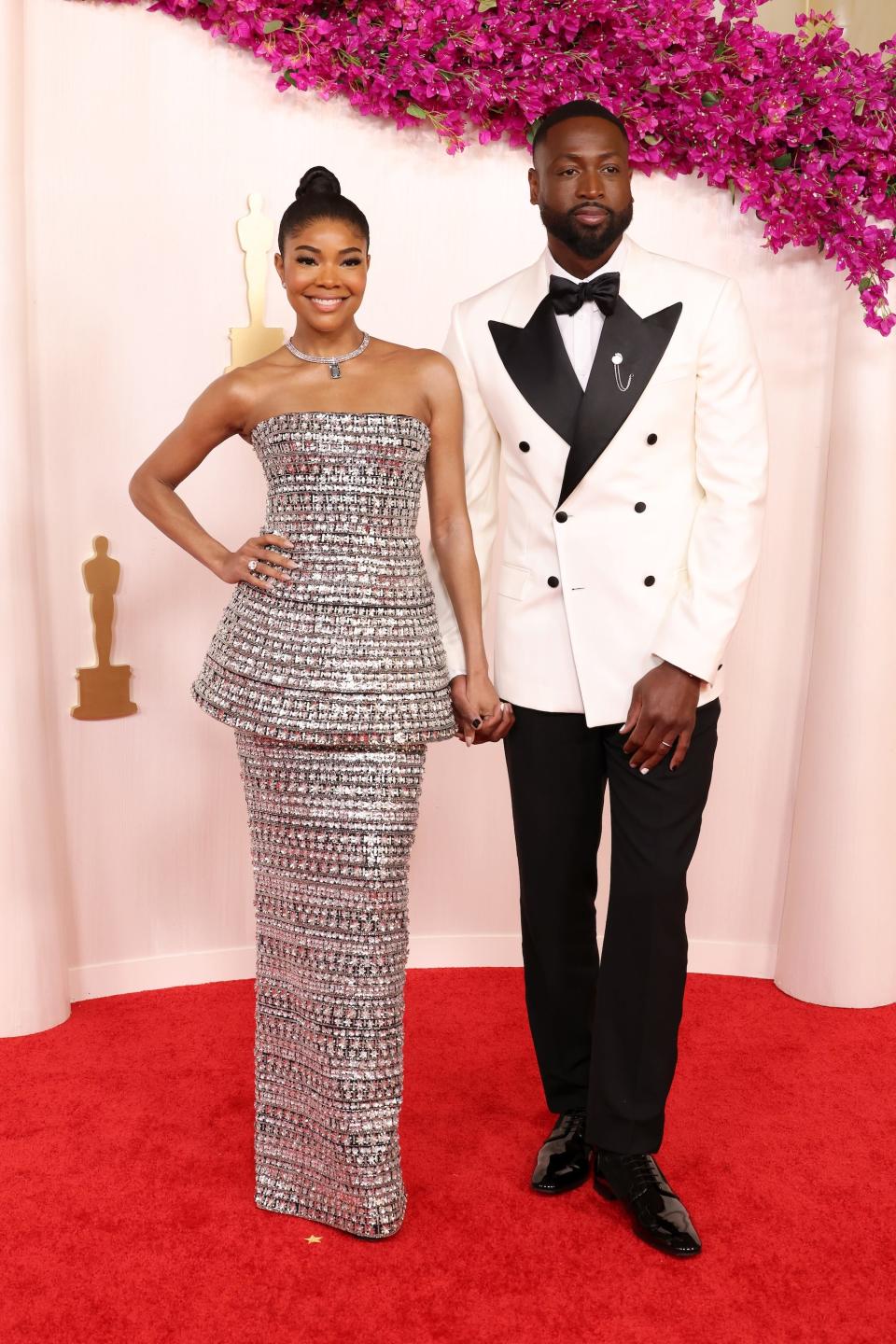 Gabrielle Union-Wade and Dwyane Wade attend the 2024 Oscars.