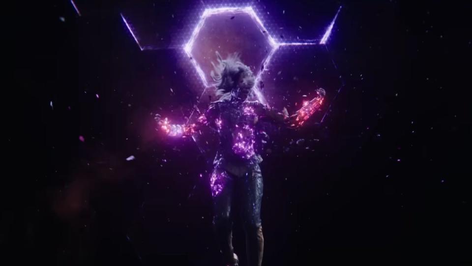 Dar-Benn glowing purple and breaking apart in front of a jump point in space in The Marvels