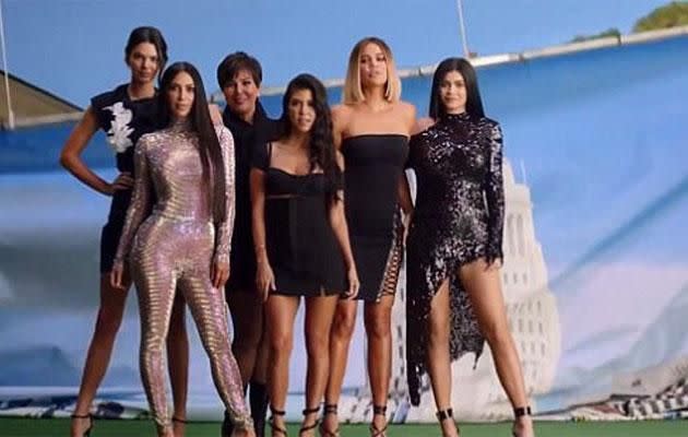 Kim and the rest of the Kardashians pose in the opening credits. Source: E!