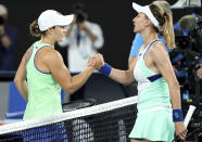 Australia's Ashleigh Barty, left, is congratulated by Lesia Tsurenko of Ukraine after winning their first round singles match at the Australian Open tennis championship in Melbourne, Australia, Monday, Jan. 20, 2020. (AP Photo/Lee Jin-man)