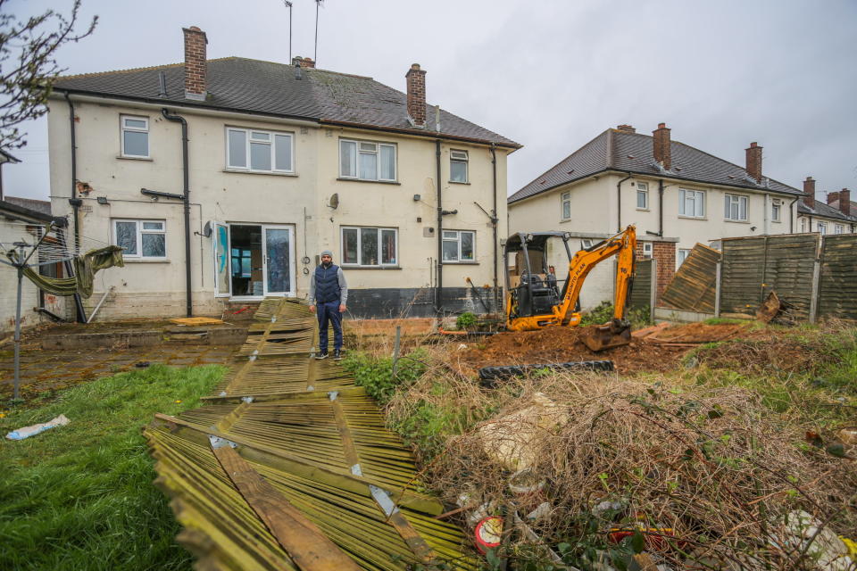 As part of the work, workers dug an enormous hole in the neighbour's garden earlier this year. (SWNS)