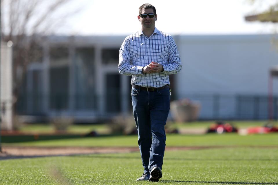 Cincinnati Reds general manager Nick Krall takes a phone call, Sunday, Feb. 16, 2020, at the Cincinnati Reds Spring Training Facility in Goodyear, Arizona. 