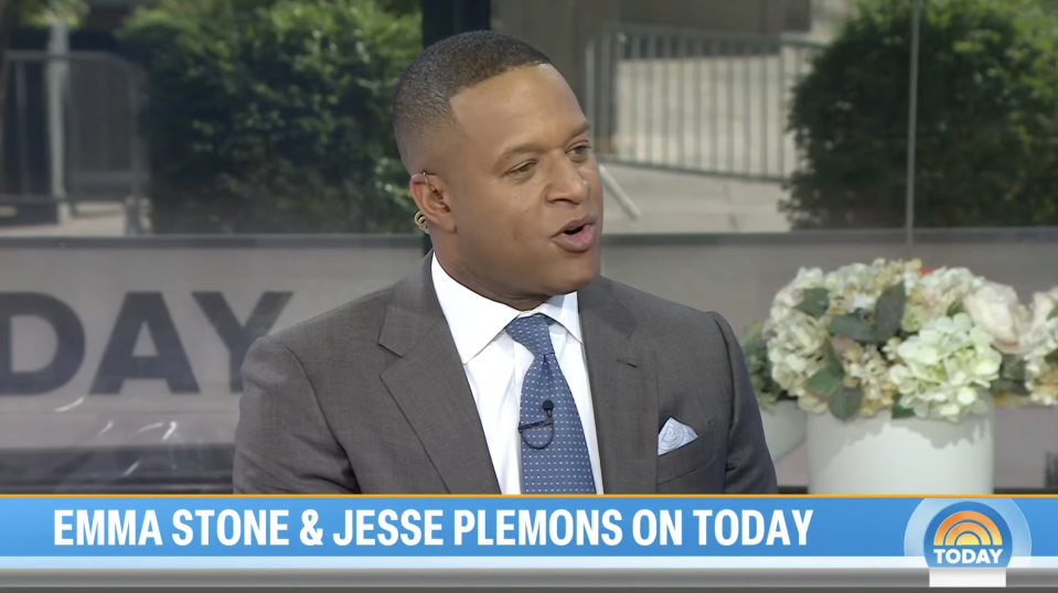 A man in a suit speaks on the "Today" show set. Text on screen: "Emma Stone & Jesse Plemons on Today." 