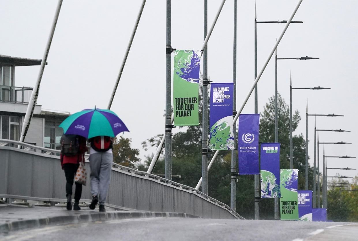 Signs advertising Cop26 hang from lamp posts near to the Scottish Event Campus in Glasgow where Cop26 is being held. Picture date: Friday October 29, 2021.