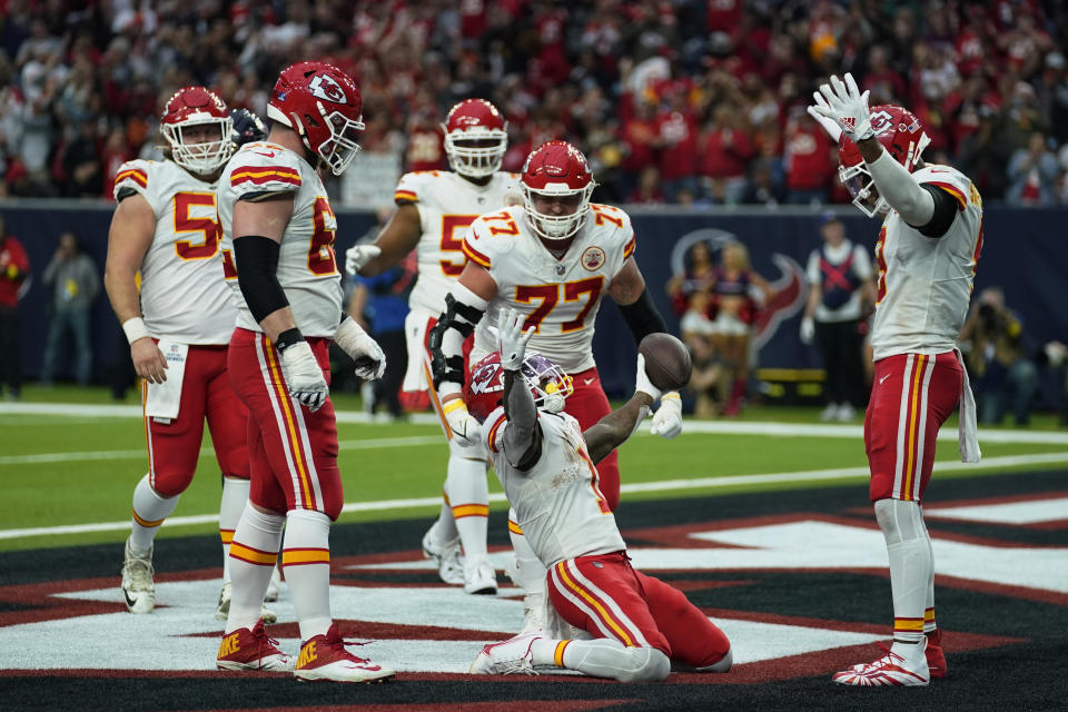 Kansas City Chiefs running back Jerick McKinnon (1) celebrates with teammates after making a catch for a two-point conversion during the second half of an NFL football game against the Houston Texans Sunday, Dec. 18, 2022, in Houston. (AP Photo/Eric Christian Smith)