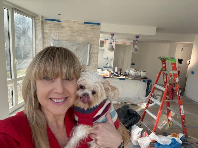 Hyman and one of her pets when the now-listed home was undergoing its renovation. Julie Hyman