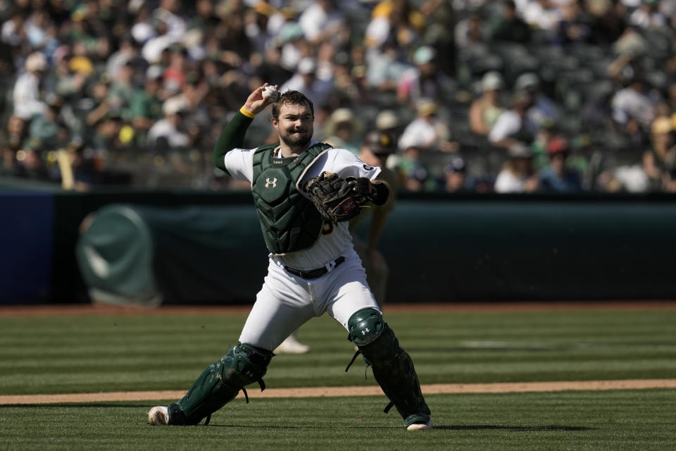 Oakland Athletics catcher Shea Langeliers throws to first for an out against San Diego Padres' José Azocar during the sixth inning of a baseball game Sunday, Sept. 17, 2023, in Oakland, Calif. (AP Photo/Godofredo A. Vásquez)