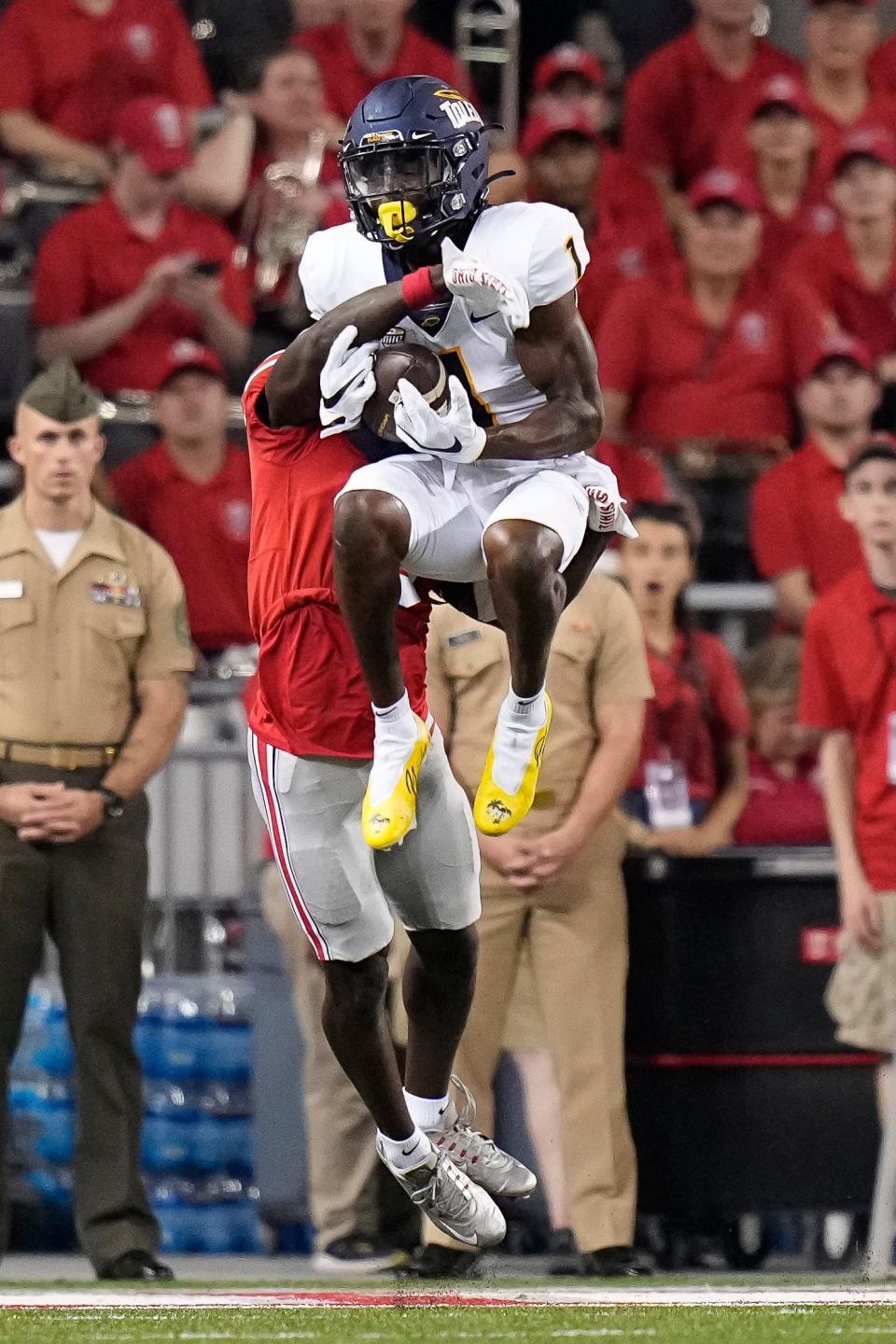 Sep 17, 2022; Columbus, Ohio, USA; Toledo Rockets wide receiver Jerjuan Newton (1) catches a touchdown pass in front of Ohio State Buckeyes cornerback Denzel Burke (5) during the second half of the NCAA Division I football game at Ohio Stadium. Ohio State won 77-21. Mandatory Credit: Adam Cairns-The Columbus Dispatch