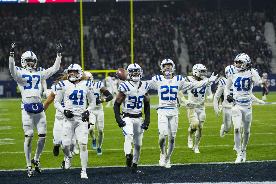 Indianapolis Colts safety Rodney Thomas II (25) celebrates with teammates after his game-sealing interception in the second half of an NFL football game against the New England Patriots in Frankfurt, Germany Sunday, Nov. 12, 2023. The Colts won 10-6. (AP Photo/Martin Meissner)