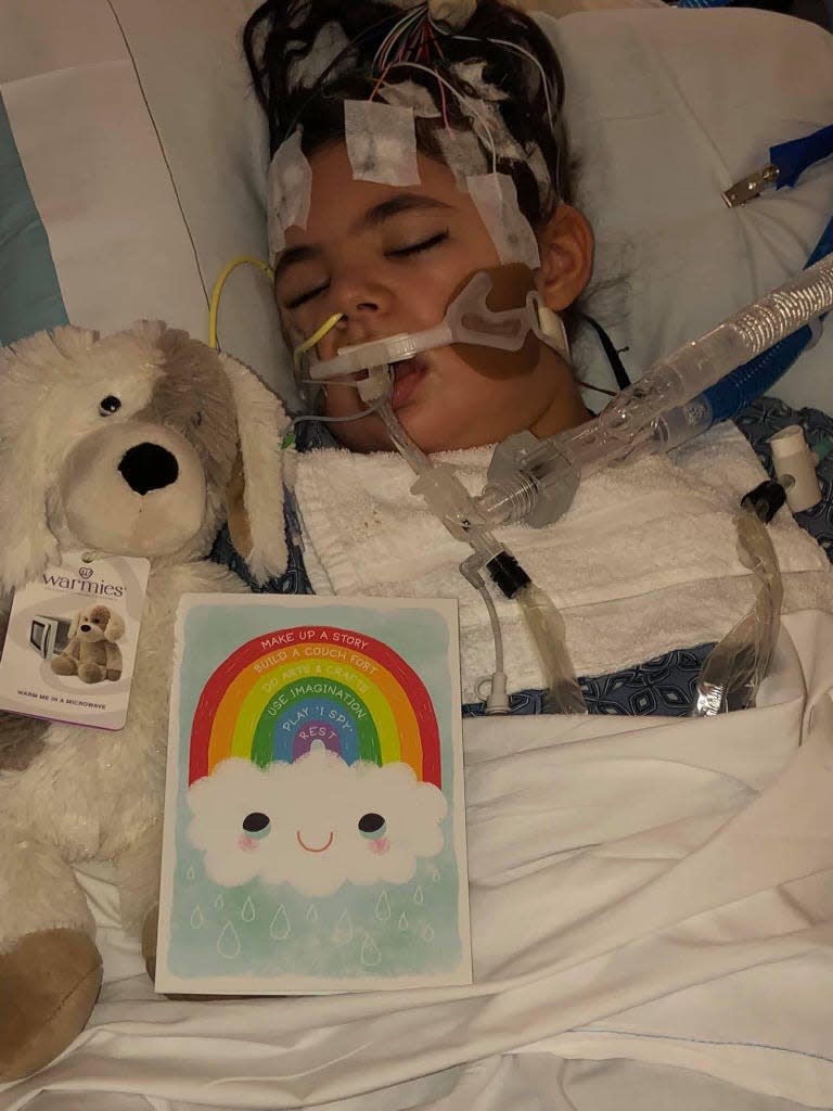 Emily Santarpia of Taunton at age 9 rests in bed at Boston Children's Hospital, where she spent three months in 2019 after a severe bout of epilepsy. As a result, she lost the ability to walk. Emily died in January at the age of 13 from complications of a rare genetic condition called isodicentric 15.
