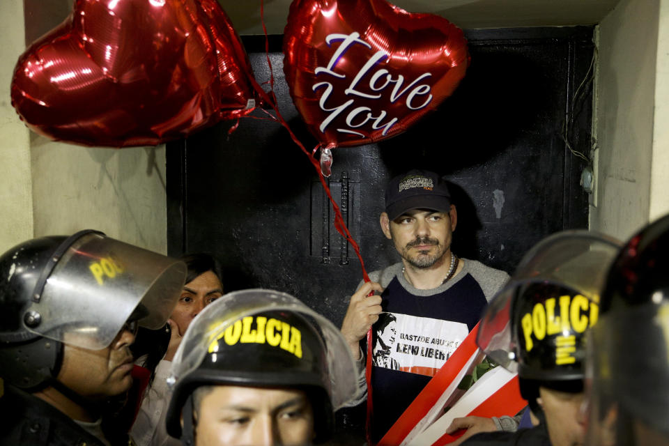 Mark Vito Villanela, husband of Keiko Fujimori, waits for her release from the Santa Mónica women's prison in Lima, Peru, Friday, Nov. 29, 2019. The Constitutional Tribunal narrowly approved a habeas corpus request to free Fujimori from detention while she is investigated for alleged accusations she accepted money from Brazilian construction giant Odebrecht.(AP Photo/Martin Mejia)