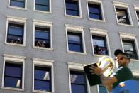 <p>Golden State Warriors fans wave from a building as Golden State Warriors Stephen Curry rides by on a float during the Warriors Victory Parade on June 15, 2017 in Oakland, California. An estimated crowd of over 1 million people came out to cheer on the Golden State Warriors during their victory parade after winning the 2017 NBA Championship. (Photo by Justin Sullivan/Getty Images) </p>