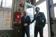 Democratic presidential candidate, former New York Mayor Michael Bloomberg, left, arrives at a coffee shop with Richmond mayor Levar Stoney in Richmond, Va., Tuesday, Jan. 7, 2020. (AP Photo/Steve Helber)