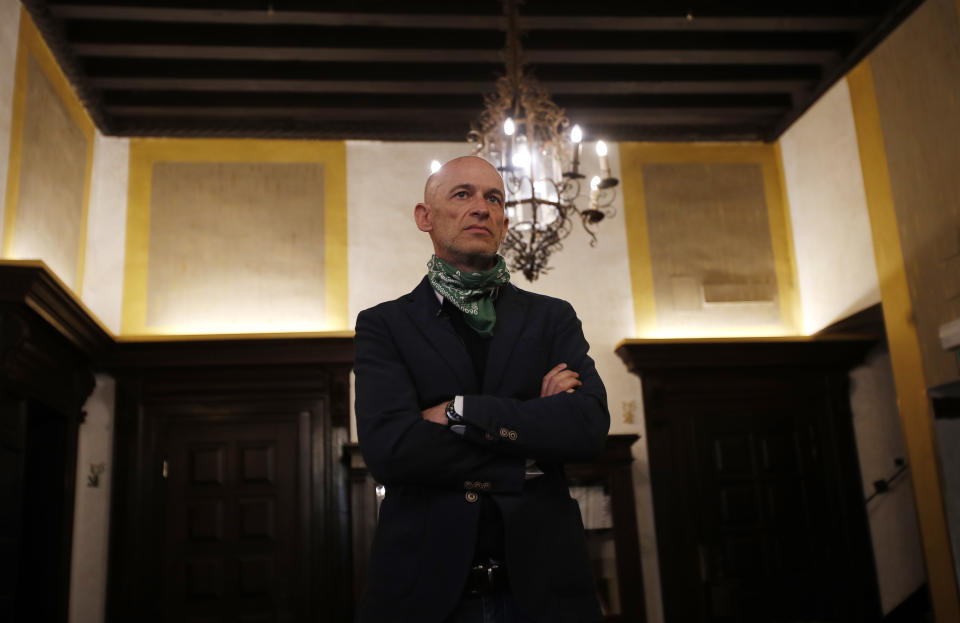 In this picture taken on Wednesday, May 13, 2020, owner of Saturnia hotel Gianni Serandrei stands as he waits for an Associated Press interview in Venice, Italy. Venetians are rethinking their city in the quiet brought by the coronavirus pandemic. For years, the unbridled success of Venice's tourism industry threatened to ruin the things that made it an attractive destination to begin with. Now the pandemic has ground to a halt Italy’s most-visited city, stopped the flow of 3 billion euros in annual tourism-related revenue and devastated the city's economy. (AP Photo/Antonio Calanni)