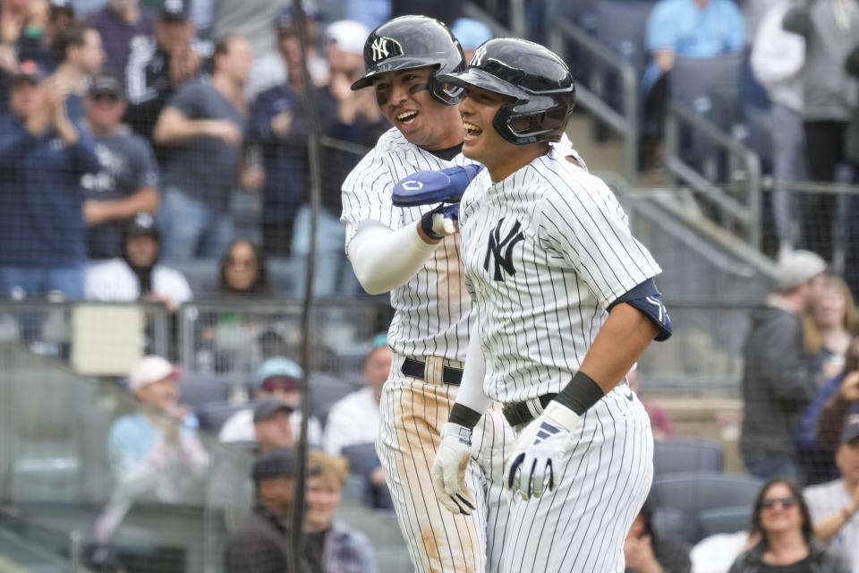 New York Yankees' Anthony Volpe, right, and Oswald Peraza celebrate after scoring off of Volpe's two-run home run in the eighth inning of a baseball game against the Toronto Blue Jays, Saturday, April 22, 2023, in New York. (AP Photo/Mary Altaffer)