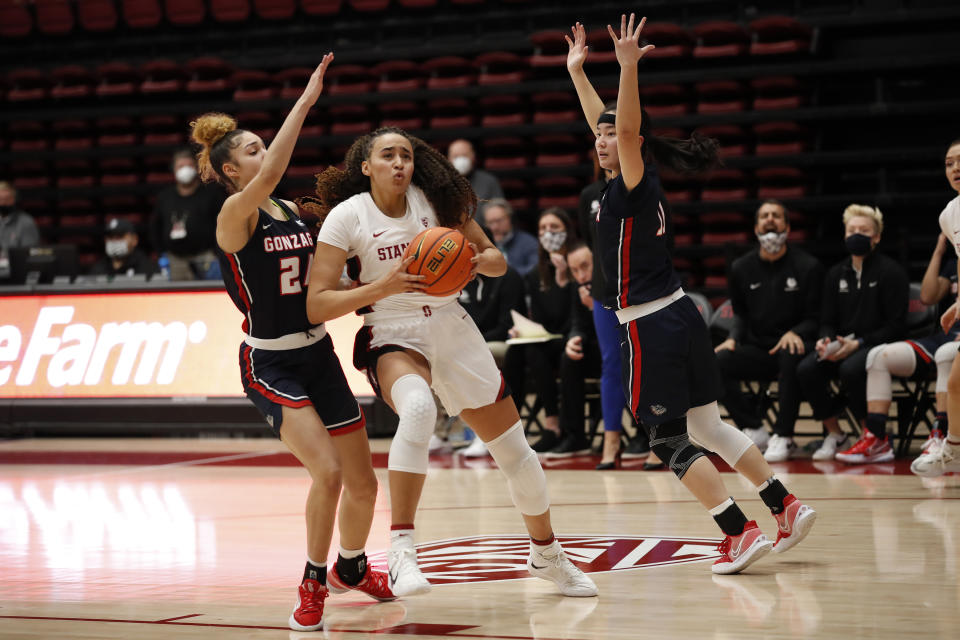 Gonzaga guard McKayla Williams (24) defends against Stanford guard Haley Jones, center, who shoots to score during the first half of an NCAA college basketball game Sunday, Jan. 9, 2022, in Stanford, Calif. (AP Photo/Josie Lepe)