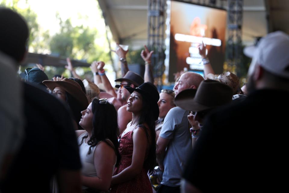 People pack the Stagecoach Smokehouse to see Old Dominion and Guy Fieri do a cooking demo during Stagecoach country music festival at the Empire Polo Club in Indio, Calif., on Saturday, April 29, 2023.