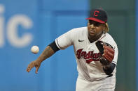 Cleveland Indians' Jose Ramirez fields a ball hit by Tampa Bay Rays' Ji-Man Choi, who was thrown out at first during the fifth inning of a baseball game Saturday, July 24, 2021, in Cleveland. (AP Photo/Tony Dejak)