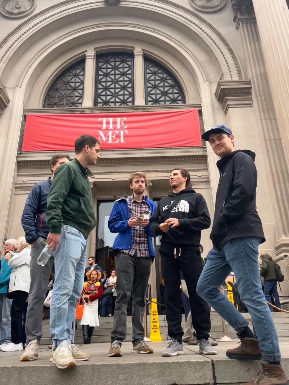 Evan Gershkovich and friends stand on the steps outside of the Metropolitan Museum in New York.