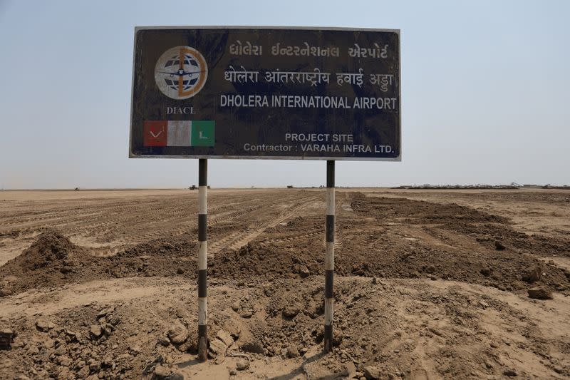 FILE PHOTO: A signboard is seen at the construction site for the Dholera International Airport near the Dholera Special Investment Region