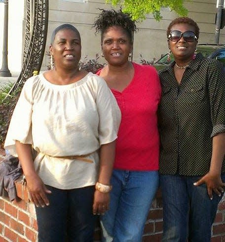 Sisters Cheryl, Regina and La Tonya hanging out downtown at the Wilmington Riverwalk.