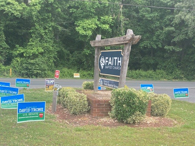 A variety of political campaign signs Tuesday outside the polling place at Faith Baptist Church in Salisbury.