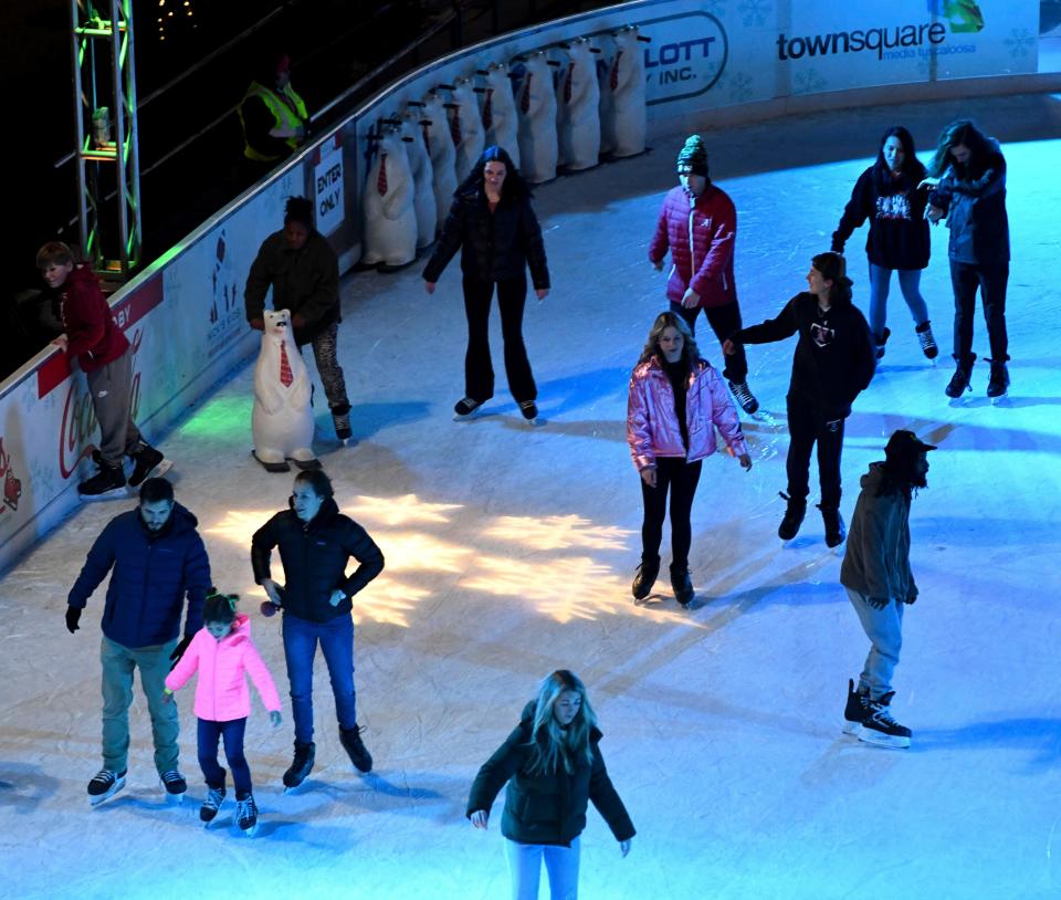 Dec 15, 2022; Tuscaloosa, Alabama, USA;  Skaters enjoy the ice rink which is part of the Holidays on the Plaza at Government Plaza in Tuscaloosa.