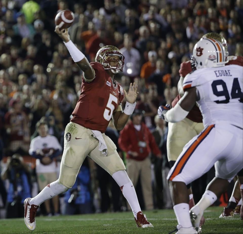 Florida State's Jameis Winston throws during the first half of the NCAA BCS National Championship college football game against Auburn Monday, Jan. 6, 2014, in Pasadena, Calif. (AP Photo/David J. Phillip)