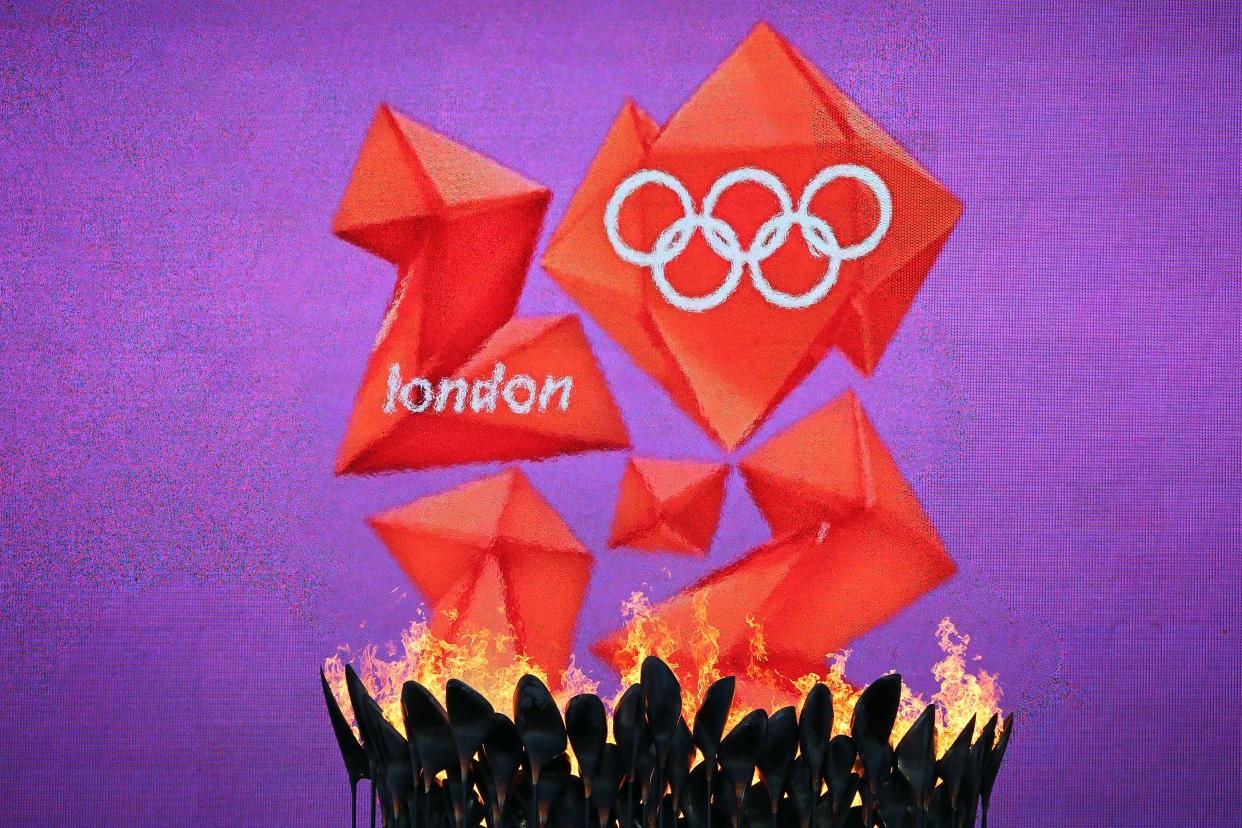 LONDON, ENGLAND - AUGUST 05:  The Olympic Cauldron burns in front of the London 2012 logo during the Women's Marathon on Day 9 of the London 2012 Olympic Games on August 5, 2012 in London, England.  (Photo by Streeter Lecka/Getty Images)