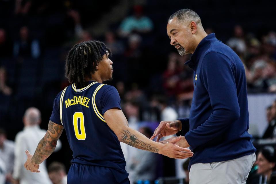 Michigan head coach Juwan Howard talks guard Dug McDaniel (0) during the second half of the First Round of Big Ten tournament at Target Center in Minneapolis, Minn. on Wednesday, March 13, 2024.