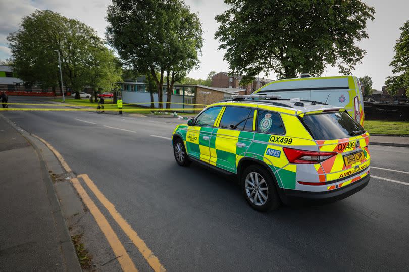 Police taped off an area outside Little Hulton Library -Credit:ASP