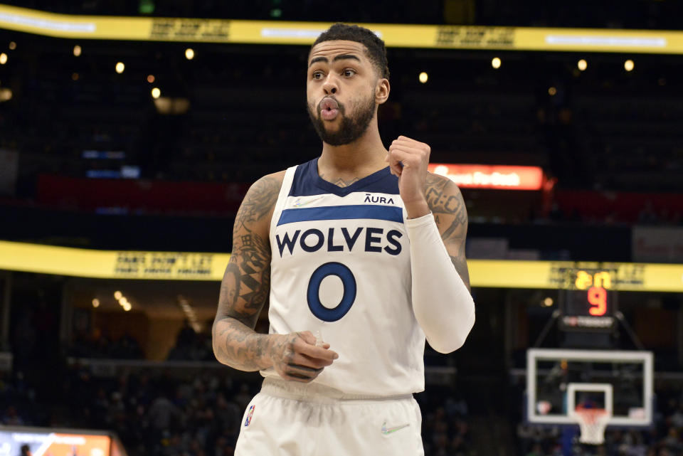 Minnesota Timberwolves guard D'Angelo Russell (0) reacts in the first half of an NBA basketball game against the Memphis Grizzlies Thursday, Jan. 13, 2022, in Memphis, Tenn. (AP Photo/Brandon Dill)